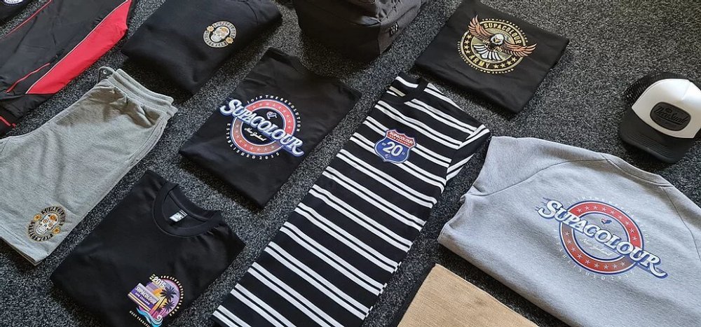 Piles of Supacolour clothing